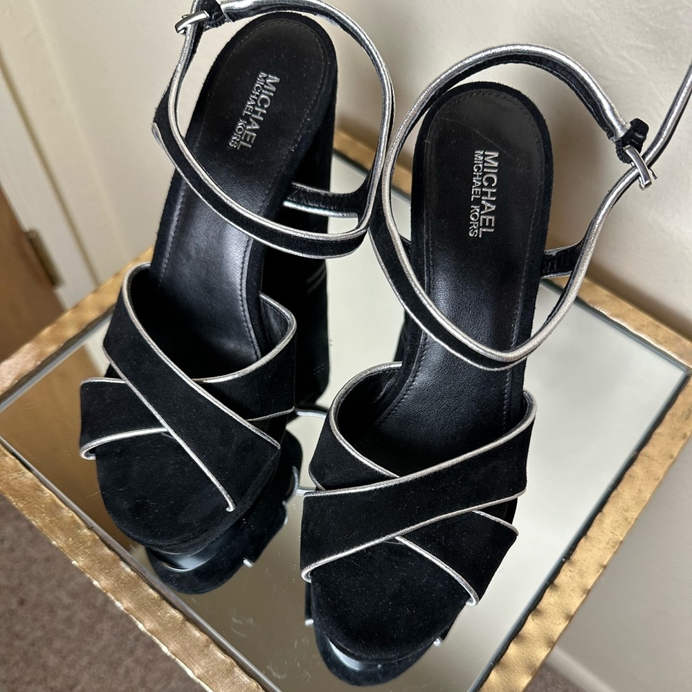 Slightly used black suede with silver trim platforms